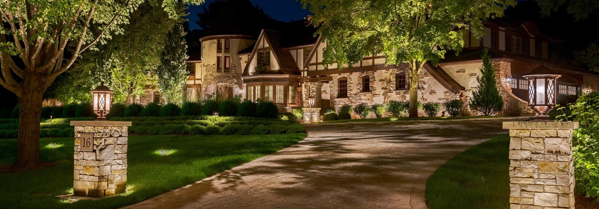 The entrance to a home is illuminated by Vista Residential outdoor LED lighting.